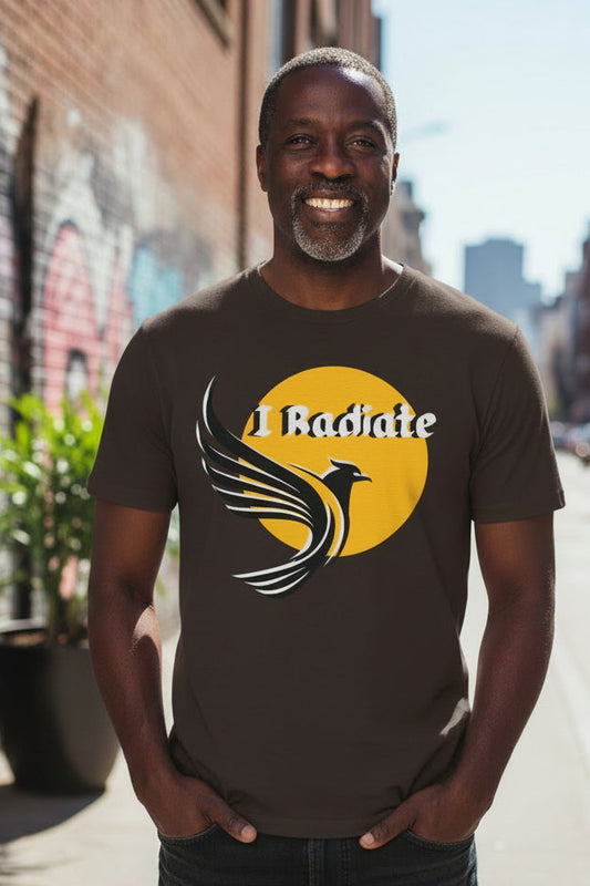A dark brown short-sleeve t-shirt with a graphic on the chest featuring a yellow sun, a stylized bird, and the text 'I Radiate' in white.