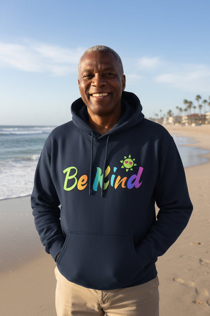 A navy blue pullover hoodie with a colorful graphic on the chest that reads 'Be Kind' in a rainbow gradient, accompanied by a small smiling sun character above the letter 'K'.