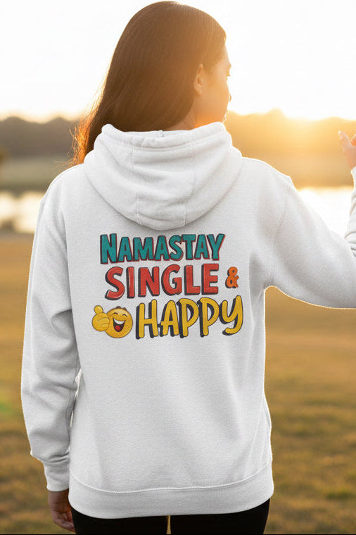 A white pullover hoodie shown from the back, featuring a colorful graphic print that reads 'NAMASTAY SINGLE & HAPPY' with emoji-style faces.