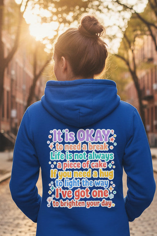 A royal blue hoodie shown from the back, featuring a colorful printed quote on the back in white, pink, light blue, yellow, and orange text with small star and heart accents.